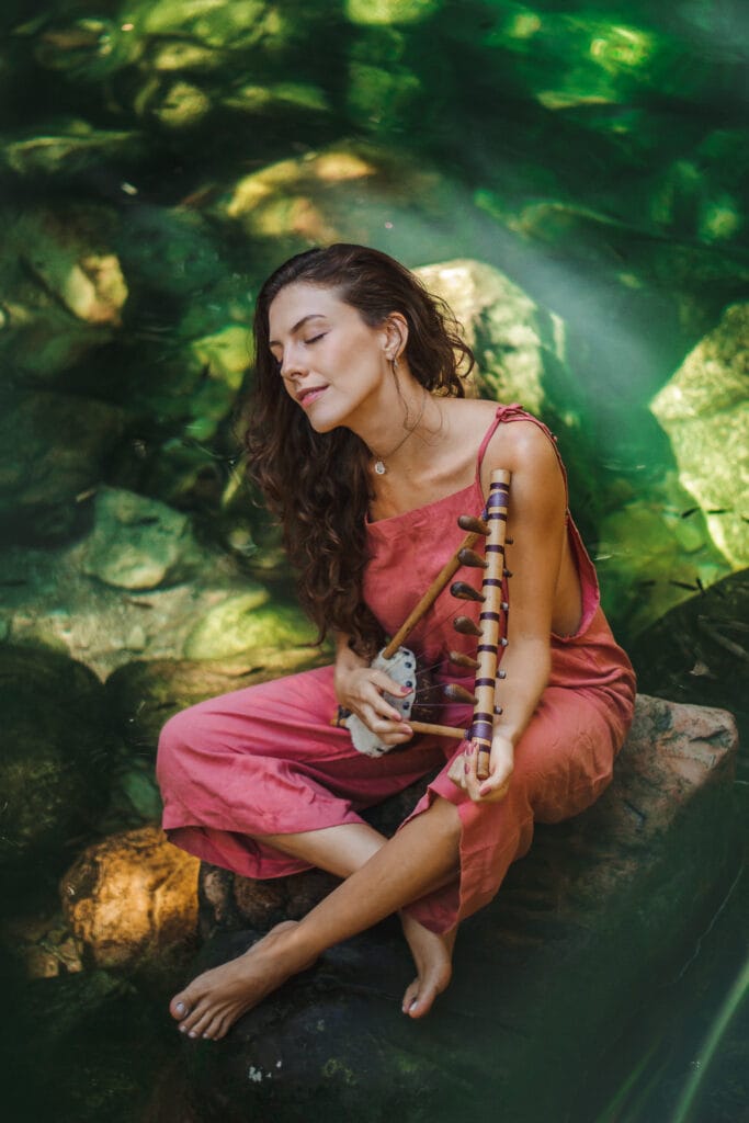 Woman sitting on a tree branch, portrait session in Gold Coast