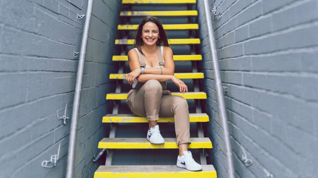 Woman sitting on a staircase, urban portrait session in Gold Coast