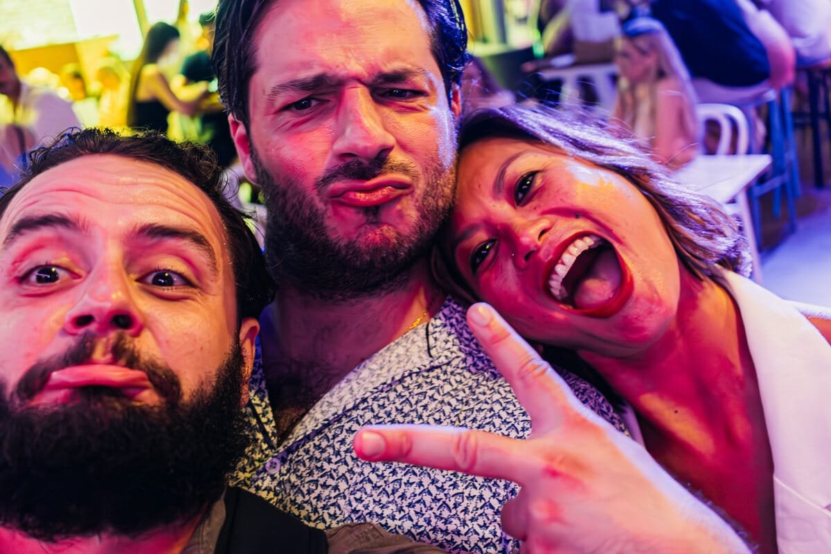 Guests laughing close to the camera at a venue, event photography in Gold Coast