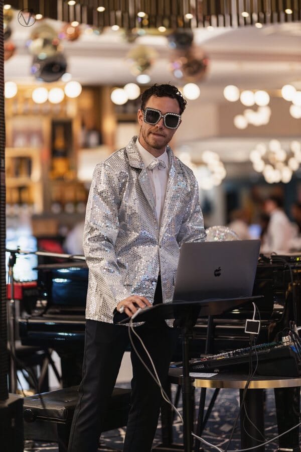 The host running a hotel karaoke night, event photographer at work