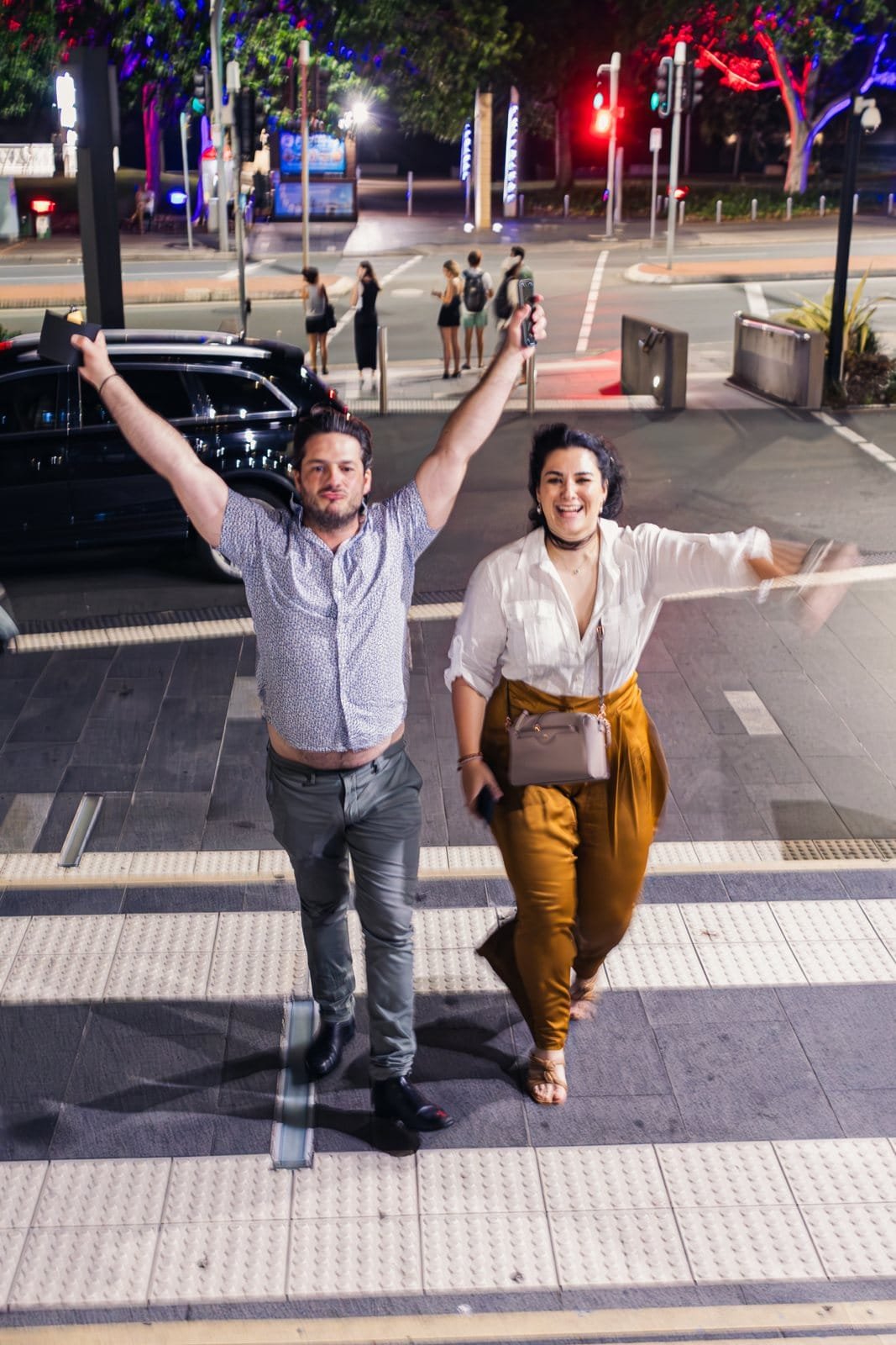 A couple celebrating outside a Gold Coast venue