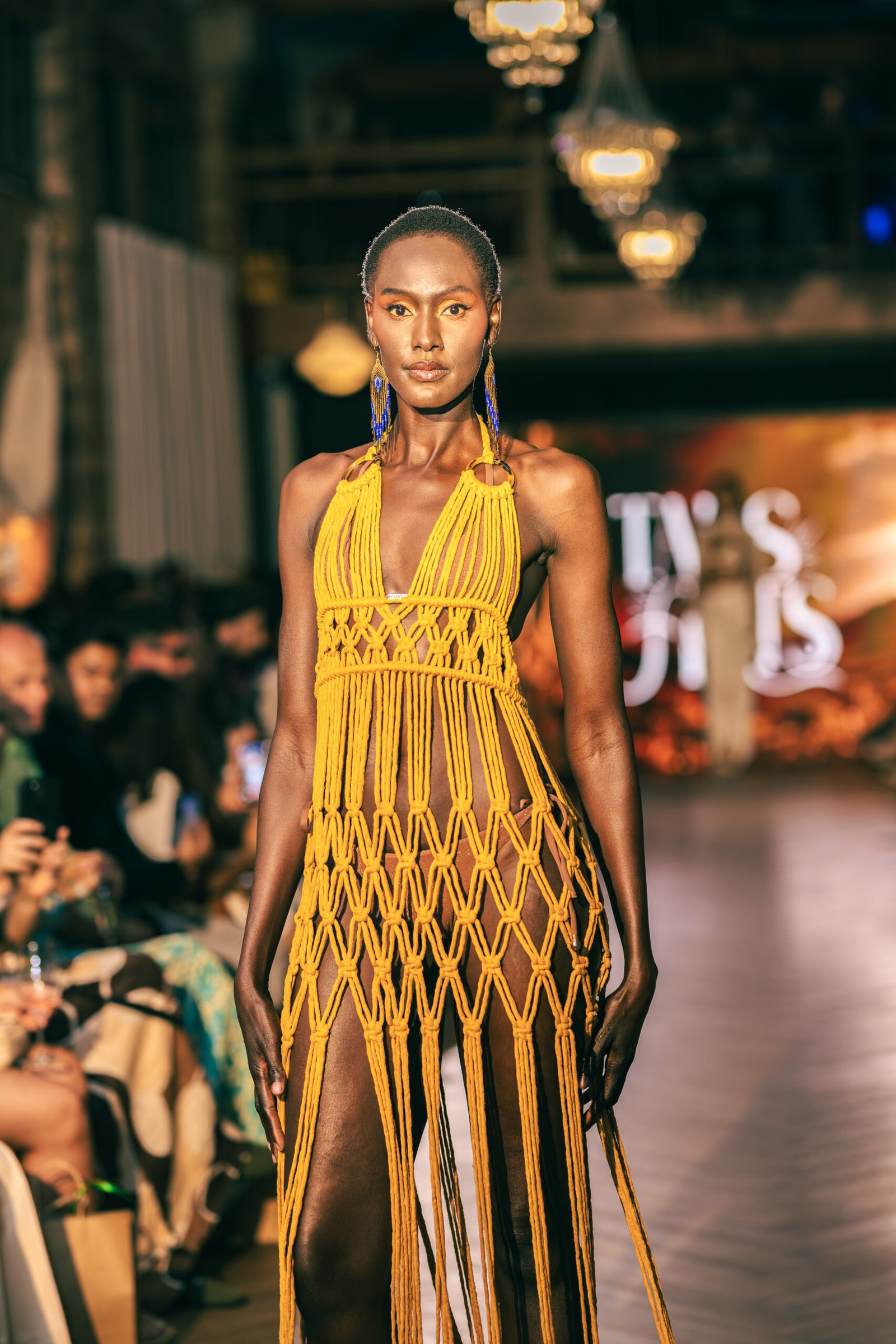 Model on the runway in a yellow macrame dress, Brazil Week Fashion Day