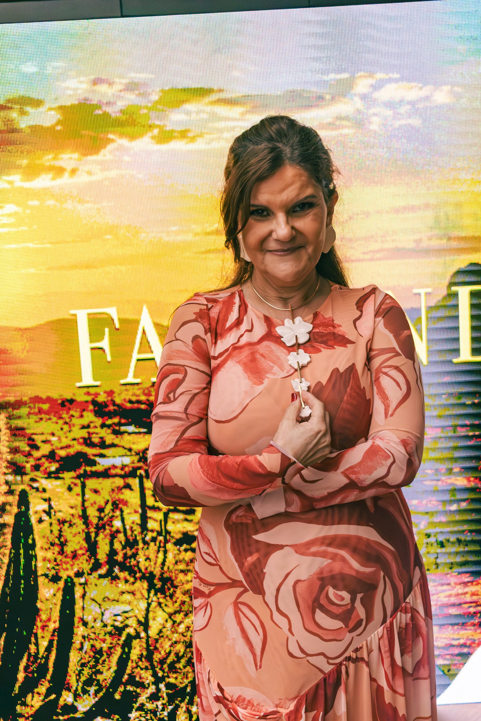 Guest portrait in front of the Fashion Day backdrop